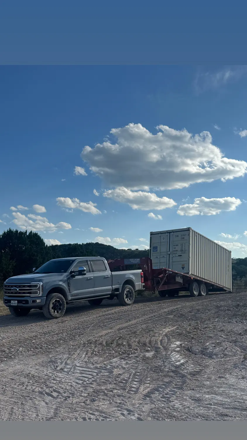 254 Shipping Containers truck delivering a one-trip storage container