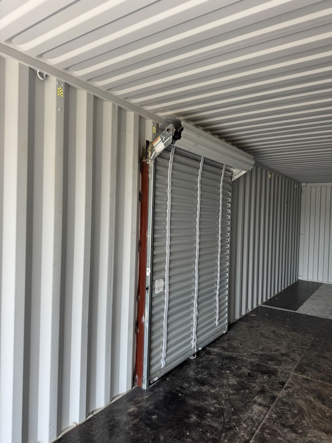 Interior view of a roll-up door installed on a container sidewall