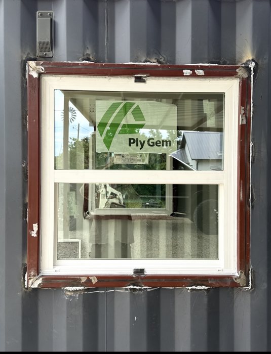 Example window installed in a dark gray shipping container